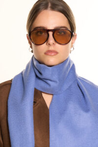A folded plaid cashmere scarf in a high-quality gift box.