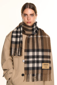 A folded red tartan cashmere scarf.