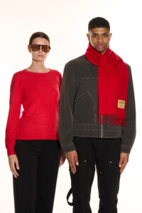 A couple sharing a cosy winter moment, each wearing an Scott Cashmere scarf