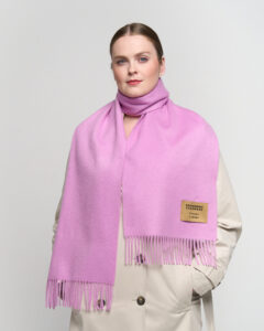 Gift-wrapped cashmere scarf next to a handwritten Valentine’s card